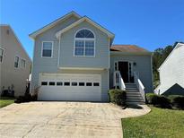 Charming two-story home with a two-car garage and well-maintained front yard at 3889 Sidney Lanier Blvd, Duluth, GA 30096