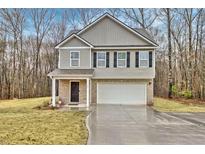 Charming two-story home with a brick front, black shutters, and a well-manicured lawn at 370 Cassidy Trl, Douglasville, GA 30134