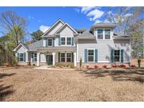 Charming two-story home with a manicured lawn and traditional architecture, perfect for Gathering living at 165 West Lake Blvd, Carrollton, GA 30116