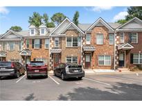 Charming townhomes feature brick facades and well-maintained landscaping at 2372 Johnson Rd, Atlanta, GA 30345