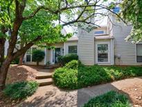 Charming home with a well-manicured front yard and a cozy entrance at 666 Serramonte Drive Dr, Marietta, GA 30068