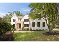 Stunning two-story home with a stone entryway and professionally landscaped front yard at 3292 Lenox Ne Pl, Atlanta, GA 30324