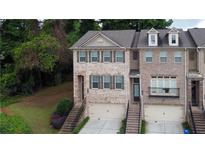 Charming brick townhome with two-car garage and well-maintained landscaping in a desirable neighborhood at 1949 Townsend Ne Ct # 22, Atlanta, GA 30329