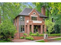 Charming brick home with manicured landscaping and a welcoming entrance at 1026 Reeder N Cir, Atlanta, GA 30306