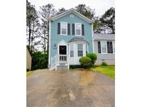 Charming two-story home features a welcoming entrance and well-maintained landscaping at 755 Heritage Valley Rd, Norcross, GA 30093