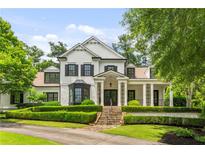 Stunning two-story home with manicured landscaping and a welcoming front porch at 980 Fenimore Cir, Atlanta, GA 30350