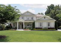 Charming two-story home with a well-manicured lawn and inviting front porch at 2909 Redding Road Northeast, Atlanta, GA 30319