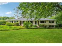 Charming ranch-style home with well-manicured front yard and lush landscaping at 2900 Townley Cir, Atlanta, GA 30340
