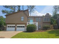 Charming two-story home featuring a two-car garage and a welcoming front porch at 1194 Clichy Ct, Marietta, GA 30066