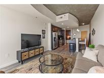 Modern living space featuring an open floor plan with stainless steel appliances at 361 17Th St # 2120, Atlanta, GA 30363