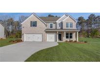 Charming two-story home with a two-car garage and a well-manicured lawn at 112 Felicity Pike, Locust Grove, GA 30248