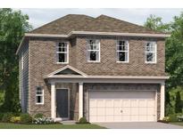 Two-story brick home with a two car garage and a covered front porch at 1240 Arnhem Dr, Hampton, GA 30228