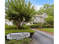 Charming townhome community with mature trees and manicured landscaping at 812 Dixie Ne Ave, Atlanta, GA 30307