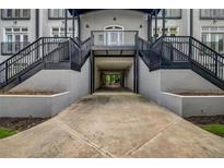 View of the entrance to the building with dual staircases and covered drive through area at 502 Sw Pryor Sw St # 325, Atlanta, GA 30312