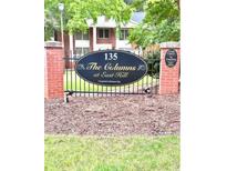 Attractive neighborhood sign with black iron fencing and brick pillars at 135 E Hill St # 22, Decatur, GA 30030