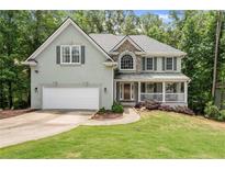 Charming home with well-manicured lawn, stone accents, and a front porch at 2342 Tall Timbers Ln, Marietta, GA 30066