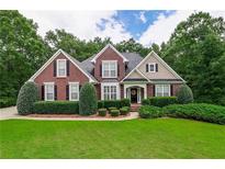 Charming brick home with manicured landscaping and a welcoming front entrance at 2995 Barimore, Dacula, GA 30019