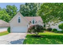 Charming home with a well-maintained front yard and a two-car garage at 12015 Harbour Town Pkwy, Fayetteville, GA 30215