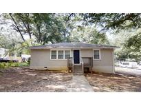 Charming one-story home with a brick facade, black front door and a cozy front porch at 568 Mcwilliams Se Rd, Atlanta, GA 30315
