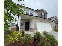 Charming two-story home with brick and stone accents and a two car garage at 2277 Whitworth St, Lawrenceville, GA 30044