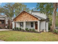 Charming painted brick home with cedar shake gable and well-manicured lawn at 458 Holly Nw St, Atlanta, GA 30318