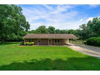 Charming single-story home featuring a well-maintained lawn and traditional brick exterior at 81 Laurie Ct, Hiram, GA 30141