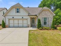 Charming single-Gathering home featuring a two-car garage and well-manicured front lawn at 2335 Plummer Sw Pl, Marietta, GA 30064