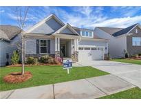 Charming craftsman-style home with a stone accent, covered porch, and well-manicured lawn at 159 Sunshower Rdg, Canton, GA 30114