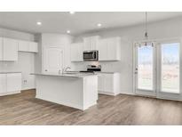 Bright kitchen with stainless steel microwave and granite countertops, perfect for cooking and entertaining at 4932 Jatoba Rd, Acworth, GA 30101