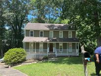 Charming two-story home with a covered porch, and well-maintained landscaping at 3808 Holy Cross Ct, Decatur, GA 30034