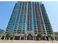 Exterior of a modern high-rise building featuring balconies and numerous windows against a clear, blue sky at 361 17Th, Chattahoochee Hills, GA 30363