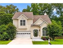 Charming two-story home featuring a well-maintained lawn, attached garage, and inviting front entrance, perfect for suburban living at 4146 Mcever Park Dr, Acworth, GA 30101
