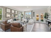 Bright living room with modern furniture and stylish decor, creating an inviting and comfortable space at 1305 Lakota Pl, Atlanta, GA 30315