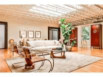 Bright living room with skylights, hardwood floors, and modern decor, perfect for entertaining and relaxation at 1933 Mclendon Ne Ave # A, Atlanta, GA 30307