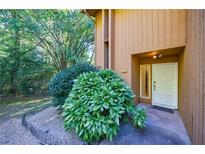 Inviting front entrance with well-maintained landscaping and a modern front door at 838 Lake Hollow Sw Blvd, Marietta, GA 30064
