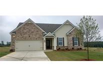 Charming single-story home with a brick facade, two-car garage, and a well-manicured lawn at 5984 Spring Way, Stonecrest, GA 30038