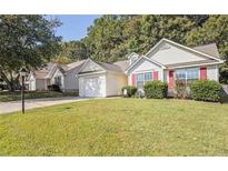 Charming single-Gathering home features a well-manicured lawn and attached garage at 159 Misty Ridge Trl, Stockbridge, GA 30281