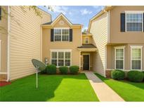 Charming two-story home with well-manicured lawn and inviting entrance at 7432 Battlecreek Ln, Jonesboro, GA 30236