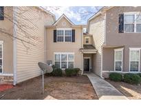 Charming townhome with neutral siding, black shutters, and a small front yard at 7432 Battlecreek Ln, Jonesboro, GA 30236