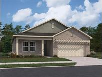 Charming single-story home featuring a brick facade, attached garage, and manicured landscaping at 329 Torcello Blvd, Mcdonough, GA 30253