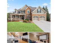 Charming two-story home featuring stone accents, a well-manicured lawn, and a two-car garage at 3130 Kates Nw Way, Kennesaw, GA 30152