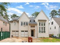 Beautiful two-story home with painted brick and hardiplank siding and a three-car garage at 2991 Surrey Ln, Atlanta, GA 30341