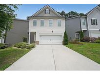 Charming two-story home featuring a two-car garage and well-maintained landscaping at 4450 Richmond Ct, Stone Mountain, GA 30083