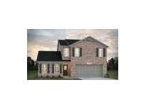 Charming two-story brick home with a dark roof, attached garage, and landscaped front yard at 5381 Tolar Rd, South Fulton, GA 30213