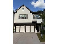 Beautiful two-story home featuring a two-car garage and modern architecture at 1923 Westfall Lndg, Auburn, GA 30011