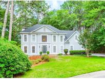 Charming two-story home with a manicured lawn and mature landscaping at 5396 Turnbill Nw Pt, Acworth, GA 30101