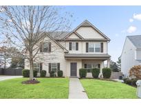Charming two-story home featuring well-maintained landscaping and a welcoming front entrance at 203 Creek View Ln, Acworth, GA 30102