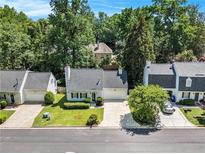 Charming single-story home with well-manicured lawn, mature trees, and driveway at 1175 Haven Brook Way, Atlanta, GA 30319