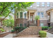 Charming brick townhome with bay window and welcoming front entrance in a desirable community at 1216 Virginia Ne Ct # 8, Atlanta, GA 30306