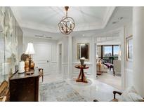 Elegant foyer features marble floors, decorative lighting, and an open view into the living space at 2660 Peachtree Nw Rd # 10H, Atlanta, GA 30305